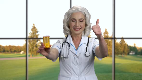 Doctor Showing Pills and Giving Thumb Up.