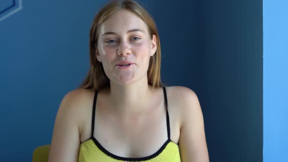 Happy Young Woman Blogger Looking Talking to Camera