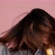 Happy pretty Asian teenager girl dancing and flicking hair on pink background, Slow motion shot. - VideoHive Item for Sale