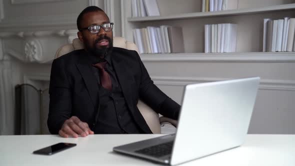 Successful Rich Lawyer Is Consulting By Internet, Sitting in His Home Office and Talking By Video