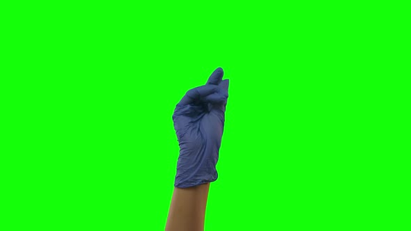 Doctors Female Hand in Blue Glove Is Clicking Fingers, Waving Index Fingers. Green Screen. Close Up