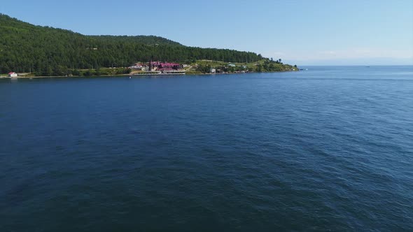 Aerial View of Building on River Shore in Countryside in Summer Day