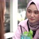 Asian hijab woman smilling in cafe with friend - VideoHive Item for Sale