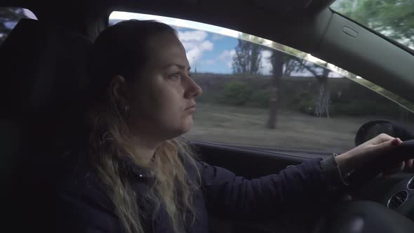 Upset Sad Thoughtful Girl Driving a Car