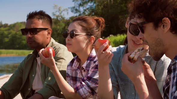 Friends Having Picnic on Wooden Terrace