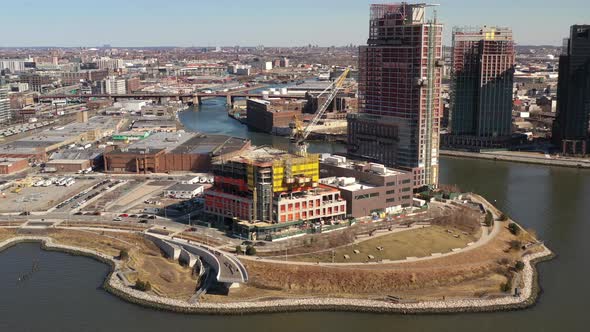 A high angle view of the East River looking towards Long Island City on a sunny day. The drone camer