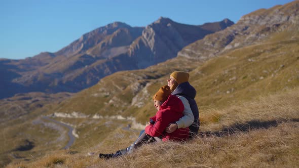 Family of Tourists Visits the Sedlo Pass Bobov Kuk in the Mountains of the Northern Montenegro