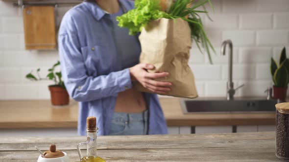 Beautiful Paper Bag From Eco Packaging With Natural Fresh Vegetables Is Placed By Female