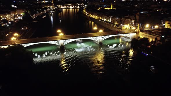 4K AERIAL VIEW OF THE CITY OF THE GUADALQUIVIR RIVER AND PUENTE ISABEL II