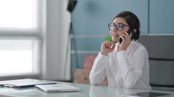 Indian Businesswoman Talking on Smartphone in Office