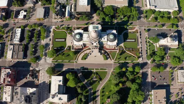 Rising drone shot over top of Idaho's State Capitol building in Boise.