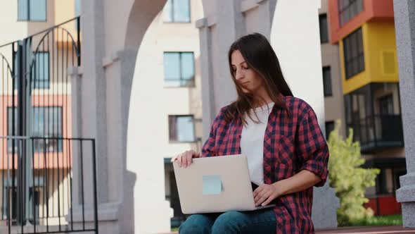 Girl Working with Laptop Outdoors