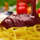 Pouring ketchup on spaghetti, tomato sauce falling on pasta, slow motion - VideoHive Item for Sale