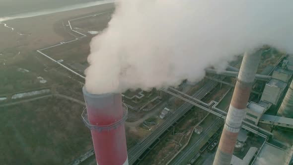Aerial Drone View Tall Chimney Pipes Grey Smoke From Coal Power Plant alt