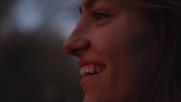 Up close view of teenage girls face as she is smiling big