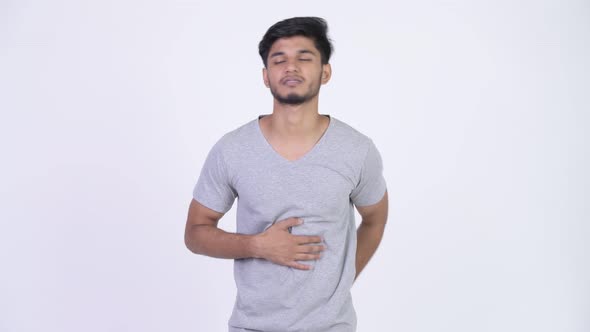 Young Stressed Bearded Indian Man Having Stomach Ache