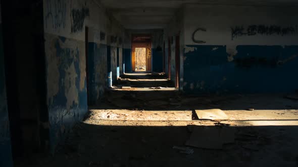 Walking Along the Corridor of an Old Abandoned Building