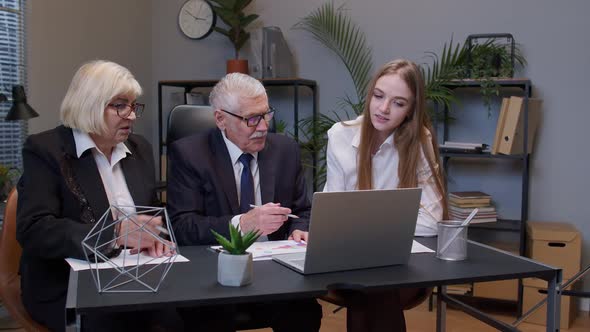 Motivated Senior Businessman Team Leader Explaining Company Development Strategy to Colleagues