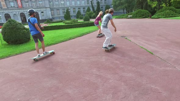 Cool young skateboarders having fun doing tricks