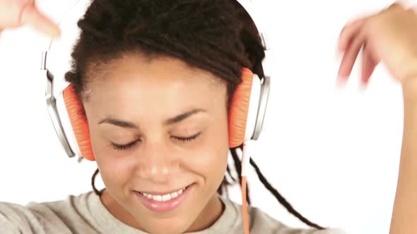 Happy Young Woman Listening Music with Headphones