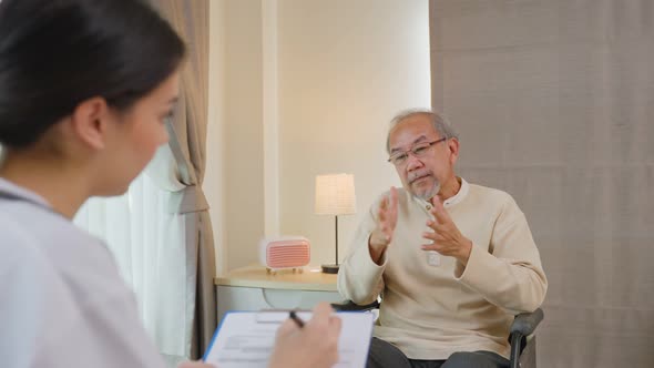 Asian Senior elderly man patient consulting and explain life problems to psychology doctor at home.