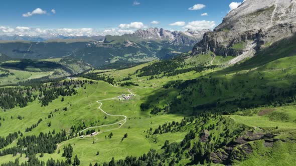 Dolomites mountains peaks with a hiking path on a summer day