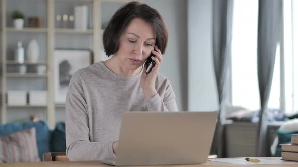 Old Senior Woman Discussing Work on Phone Talk, Negotiation