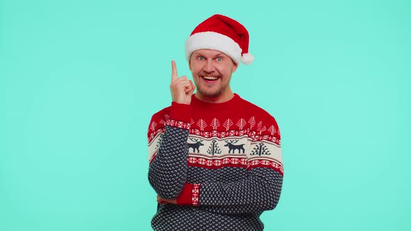 Excited Man in Red Christmas Sweater Make Gesture Raises Finger Came Up with Creative Plan Good Idea