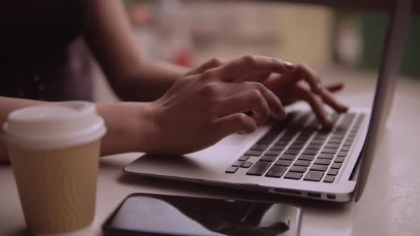 Close Up of Female Hands Working on Computer