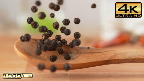 Black Peppercorns on Wooden Spoon