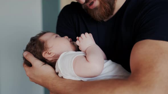 Carefree Adorable Child Lying on Father Hands