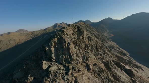 Aerial Panorama View Male Winner Standing on Mountain Ridge Peak Sun Lights Nature Landscape