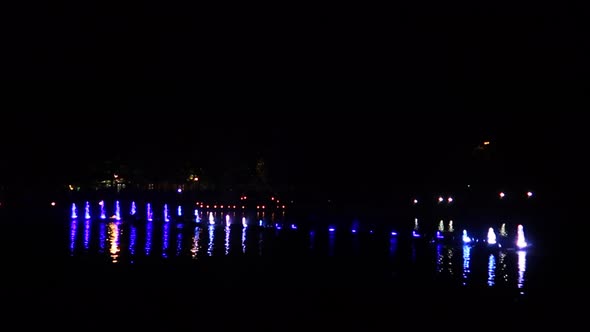 colorful water fountains over lake during light festival