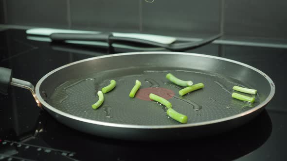 Fry off green beans on skillet pan