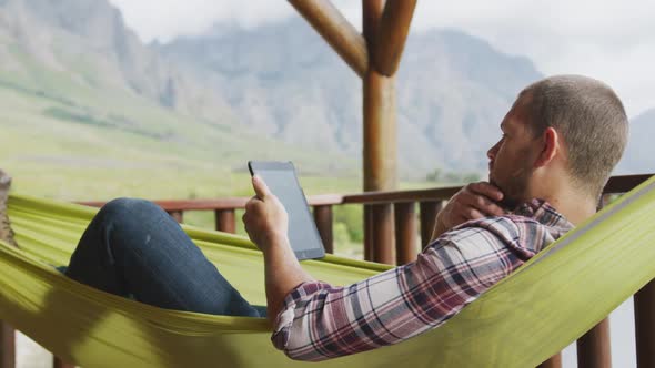 Caucasian man spending time at home using a tablet