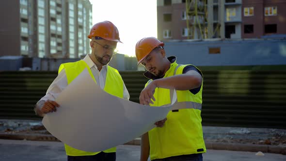 Builders Hold Their Project and Discuss Ot