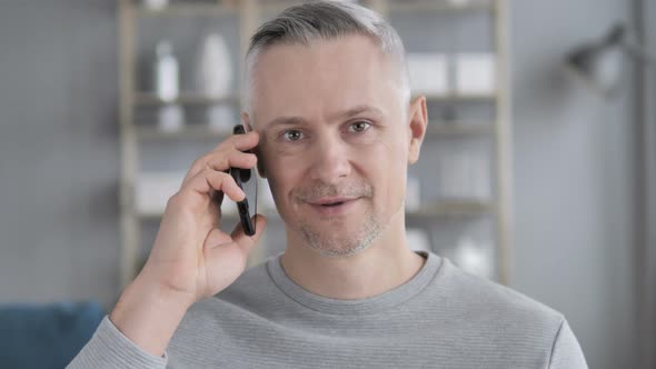 Portrait of Gray Hair Man Talking on Phone