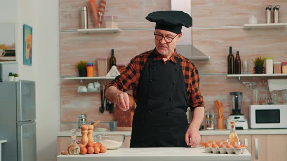 Baker Putting Flour