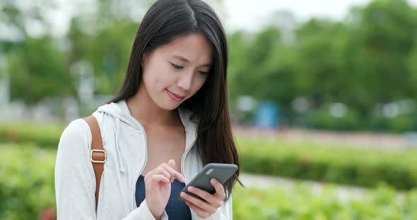 Woman working on mobile phone 