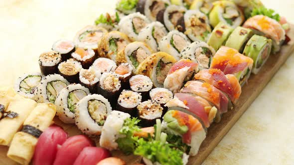 Above View of Various Sushi and Rolls Placed on Wooden Board