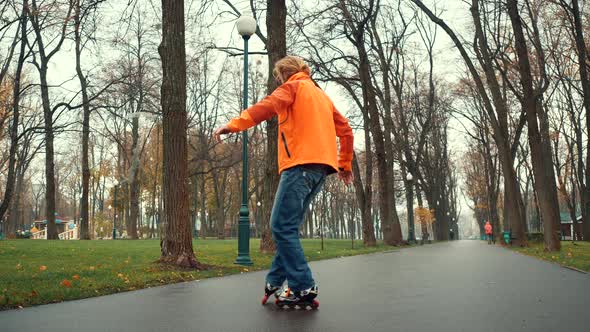 Close-up View of a Skating Bearded Professional Male Roller Skater Performing Complex Technical