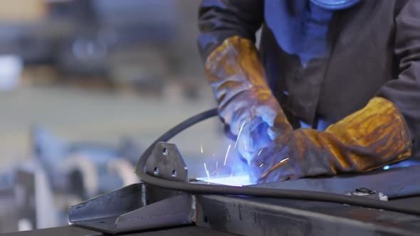 Factory Laborer Welding with Gas Torch