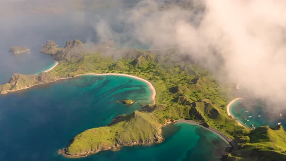 Scenic aerial view over the clouds of Padar islands during day, Indonesia.