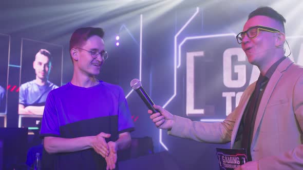 Nerdy Gamer Giving Interview During Gaming Tournament