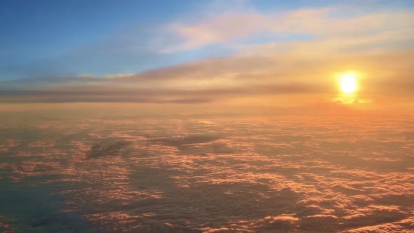Aerial View of Amazing Sunset Over Floating Clouds
