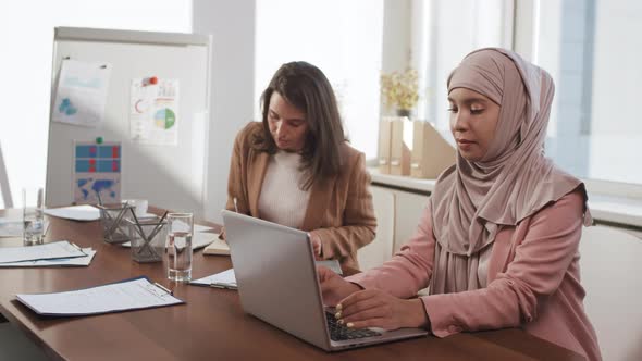 Two Women Working in Office