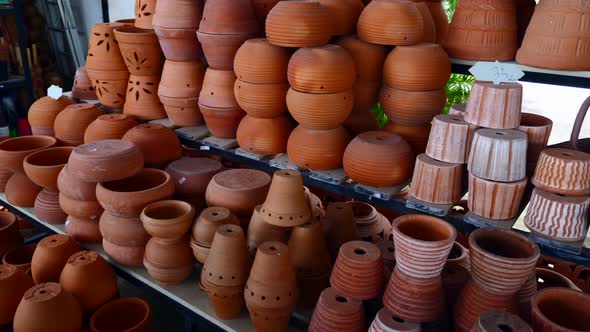 Flower Shop Selling Floral Clay Brown Pots of Various Shapes and Sizes