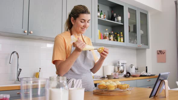 Woman Cooking Food and Baking on Kitchen at Home