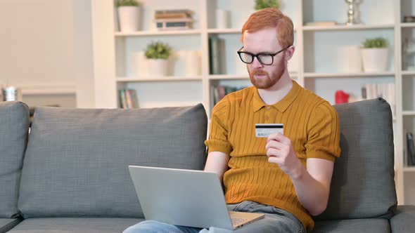 Unsuccessful Online Payment By Redhead Man on Laptop 