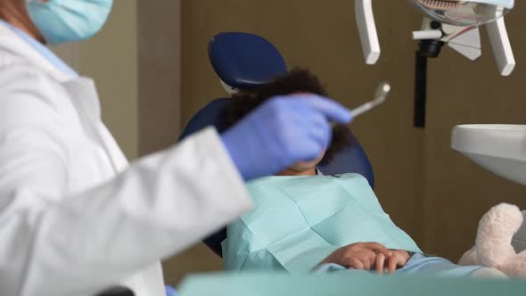 Mixed Race Kid During Teeth Examination at Dentist